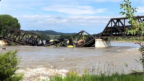 Regulators say no sign of threat from hazardous railroad cargo that plunged into Yellowstone River
